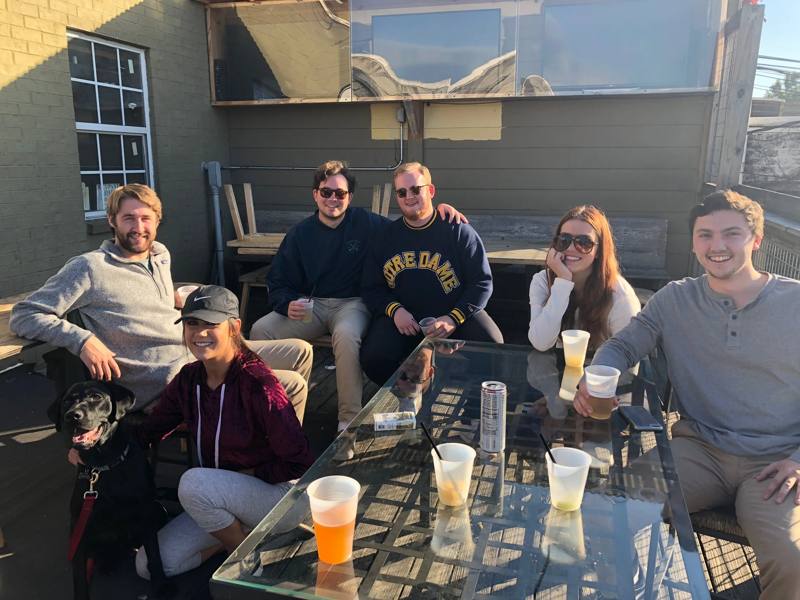Friends at a patio table in the afternoon