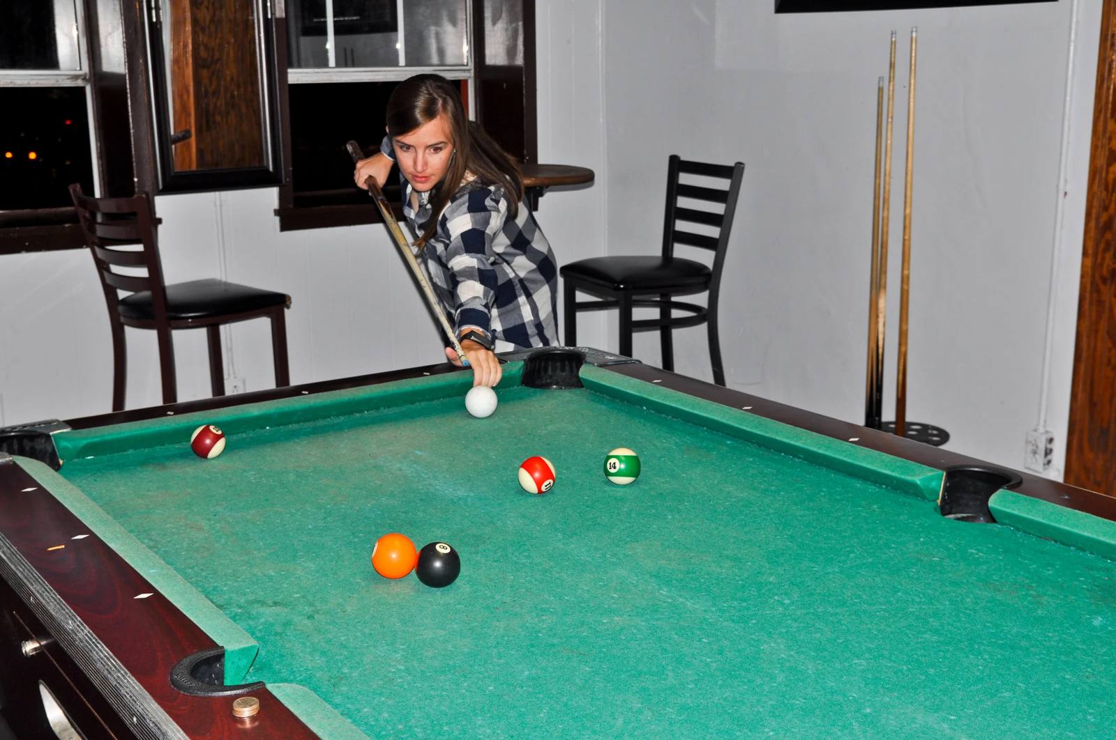 A pool table in the upstairs bar