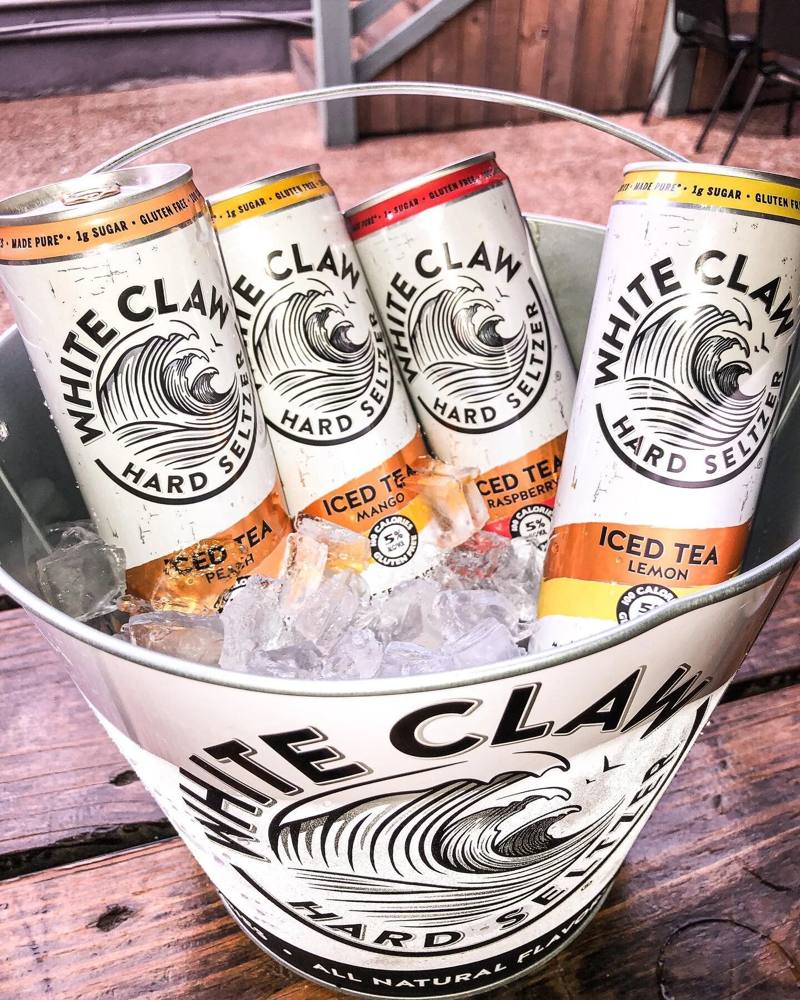 A bucket of White Claw on ice